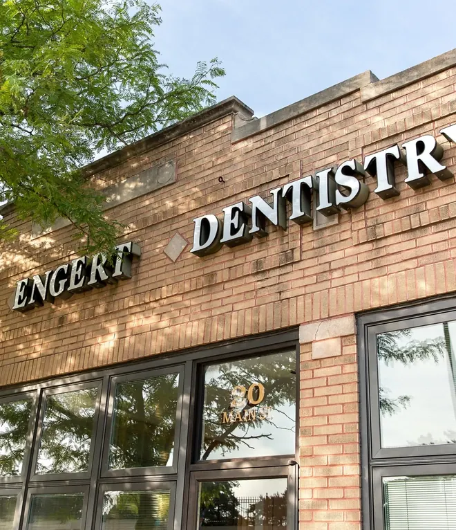 The Davis & Engert Dentistry sign above the windows at 20 Main Street.